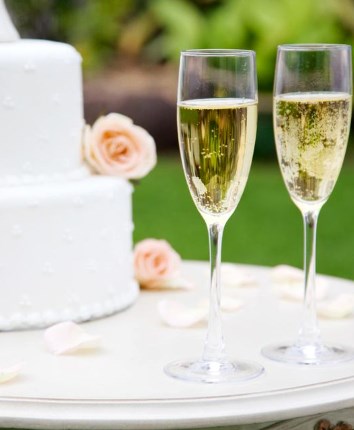 wedding cake with wine glasses